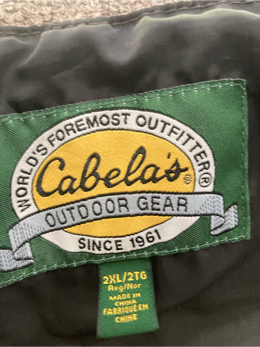 Cabela's Green and Yellow Outdoor Gear Jacket Label Detail